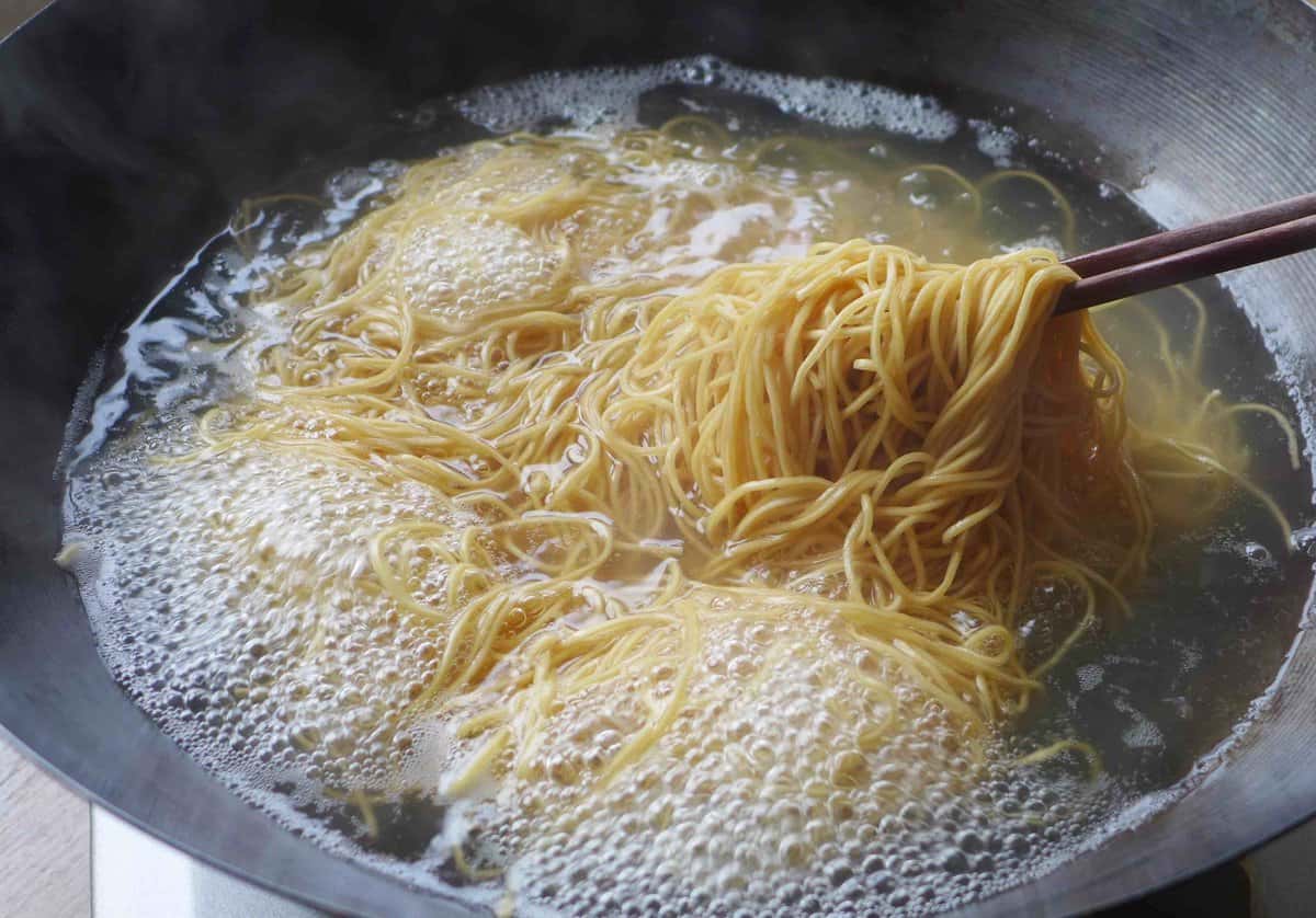 boiling egg noodles.