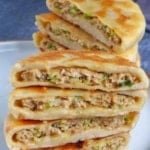 stuffed flatbread with overlay text that says chinese meat pies.