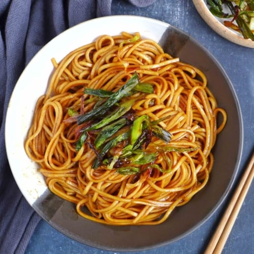 scallion oil noodles garnished with fried scallions.