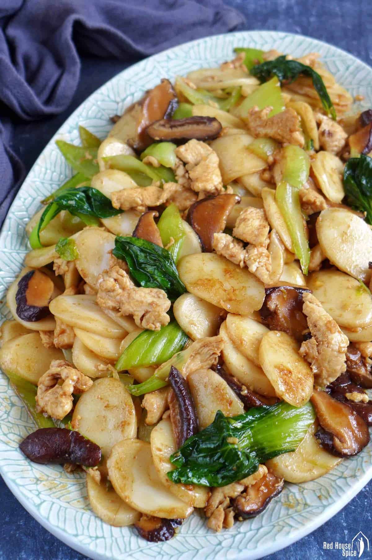 rice cakes stir-fried with chicken, mushrooms and Bok Choy.