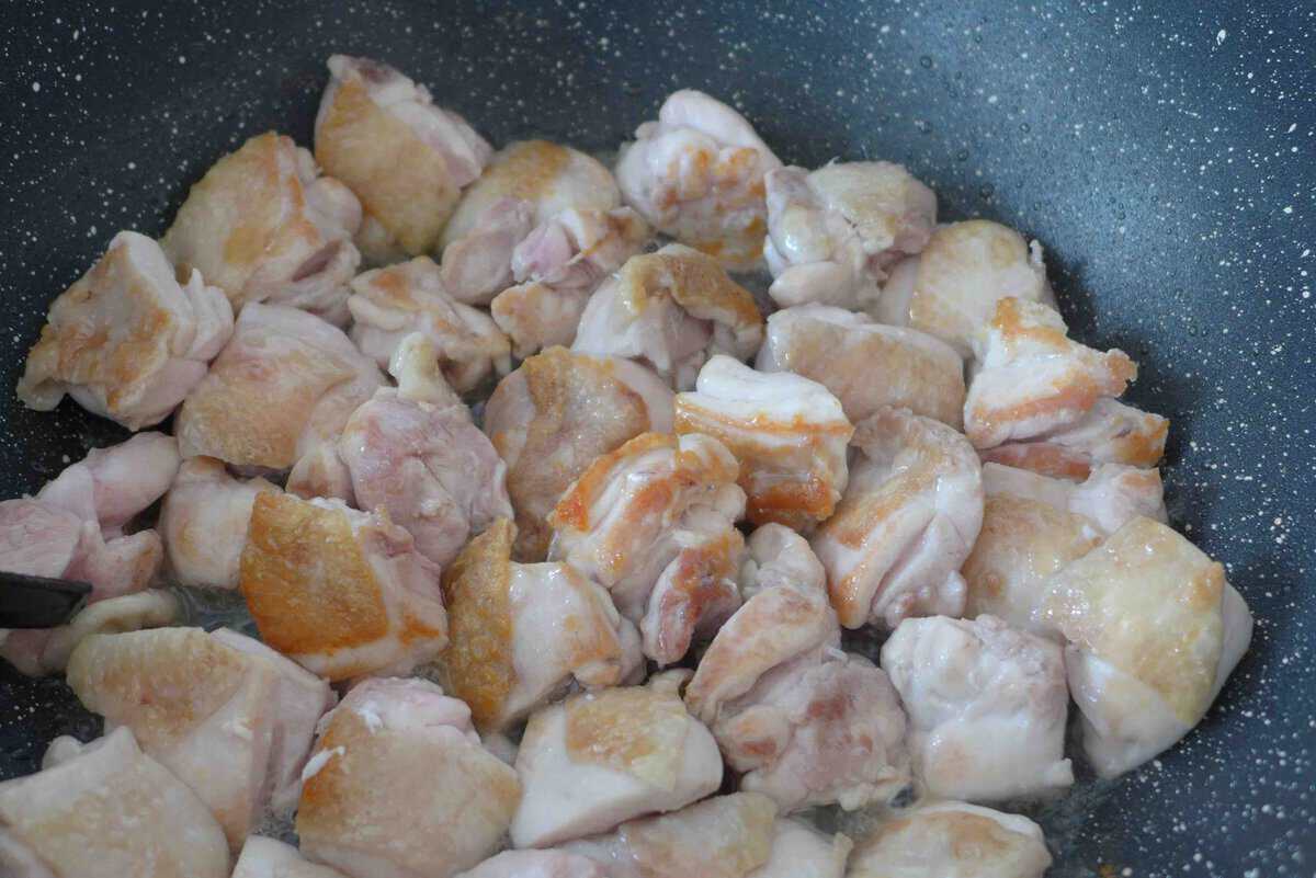 searing chicken pieces.